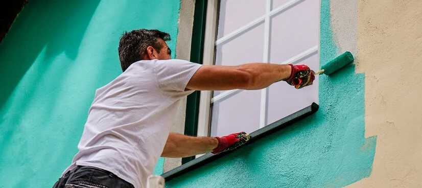 worker-paints-facade-walls-house-with-paint-using-paint-roller_1086986-232 Exterior painting toronto